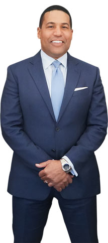 Attorney Joey Jackson in a blue suit and tie